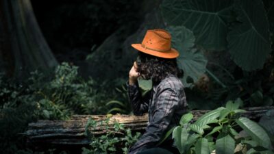 Calm investor ignoring phone amid trees, symbolizing Betterment’s anti-marketing strategy that rewards inactivity to boost lifetime value