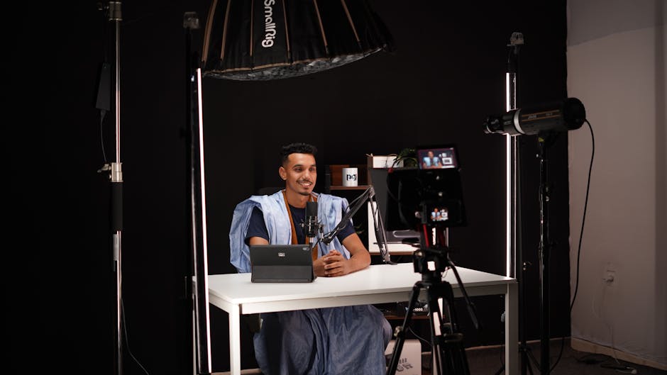 27-year-old YouTuber Jesser in sleek media studio, JesserCo logo behind, symbolizing creator-to-conglomerate evolution